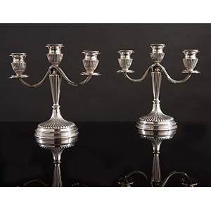 Pair of  silver candlelabra. ... 