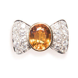 Bow  ring. Yellow  and white gold, ... 