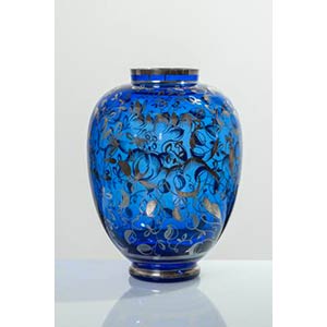 Vaso in vetro blu con superficie decorata in ... 