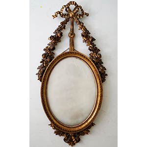 Specchiera ovale di linea Luigi XVI in legno ... 