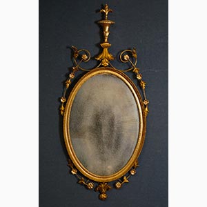 Specchiera ovale di linea Luigi XVI in legno ... 