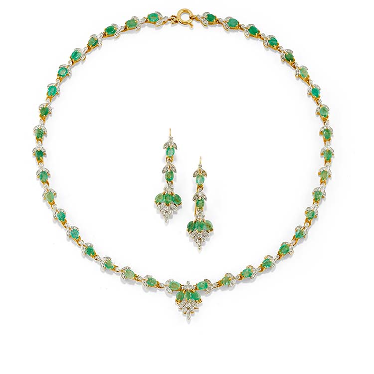 A 18K two-color gold, emerald and ... 