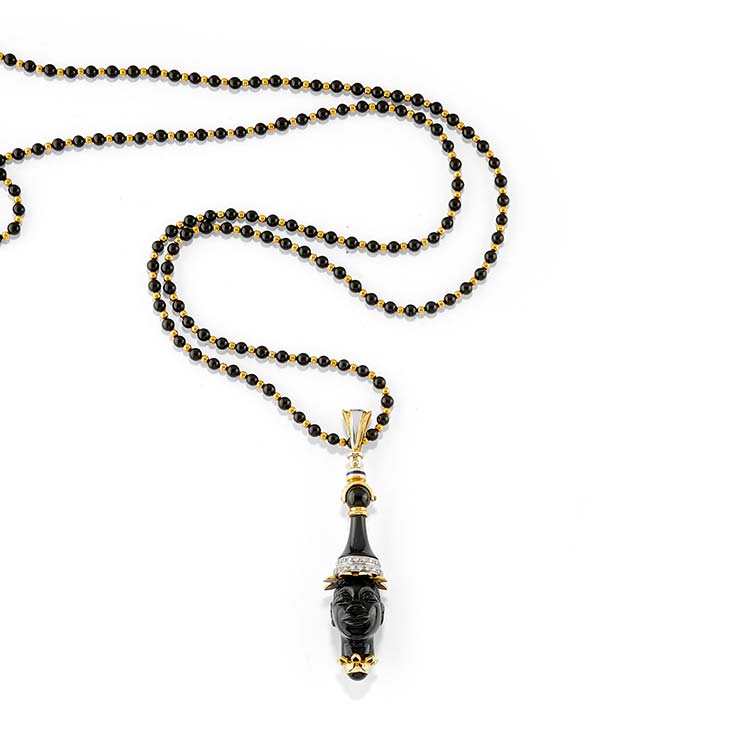 A two-color gold, diamond and onyx ... 