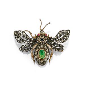 A silver, 18K yellow gold, emerald, ... 