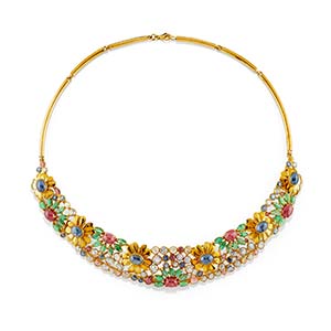 A 18K yellow gold, emerald, ruby, sapphire, ... 