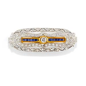 A 18K two-color gold, diamond and sapphire ... 