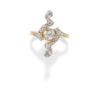 A 18K two-color gold and diamond ringWeight ... 