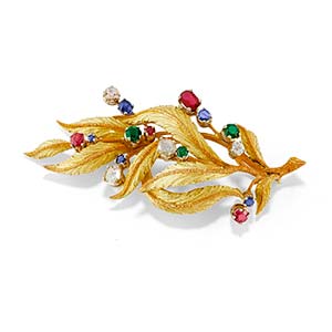 A 18K three-color gold, ruby, sapphire, ... 