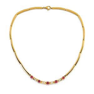 A 18K yellow gold, diamond and ruby ... 