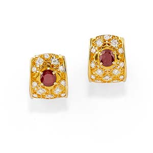 A 18K yellow gold, ruby and diamond ... 