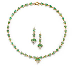 A 18K two-color gold, emerald and diamond ... 