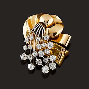 A 18K two-color gold and diamond brooch ... 