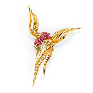 A 18K yellow gold, ruby, diamond and emerald ... 