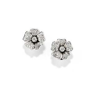 A 18K white gold and diamond earclips, ... 