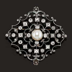 A silver, 18K yellow gold, natural pearl and ... 