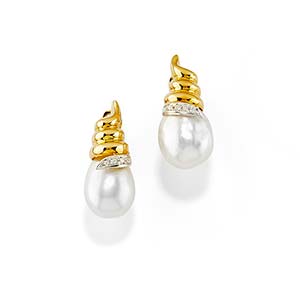 A 18K two-color gold, cultured pearl and ... 