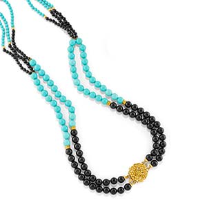 A 18K yellow gold, turquoise paste and onyx ... 