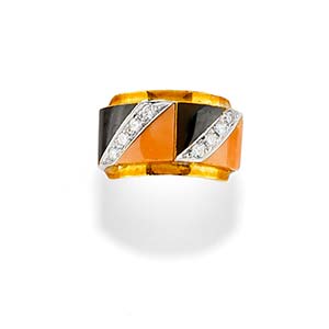 A 18K two-color gold, coral, onyx and ... 