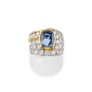 A 18K two-color gold, sapphire and diamond ... 
