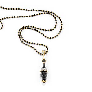 A two-color gold, diamond and onyx ... 