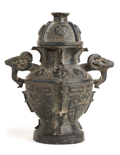 A METAL ARCHAISTIC VASE AND ... 