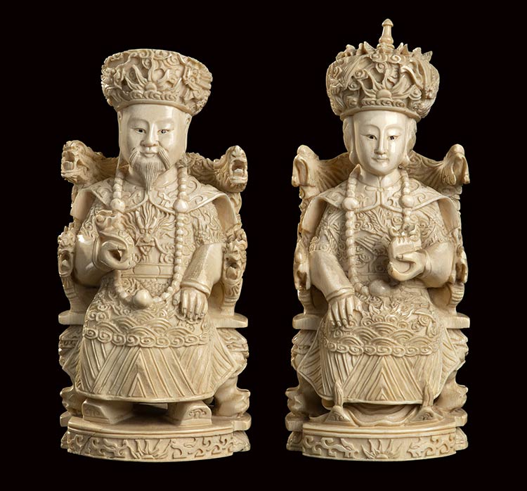 A PAIR OF IVORY CARVINGS OF THE ... 