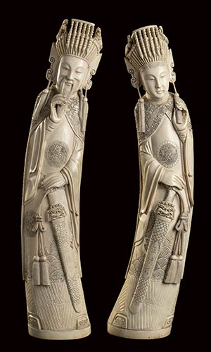 A PAIR OF LARGE IVORY CARVINGS OF ... 