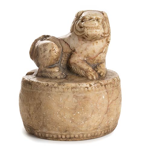 A MARBLE BUDDHIST LION ON A ROUND ... 