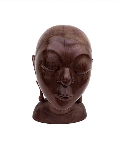 A BALINESE CARVED WOOD HEAD OF A ... 