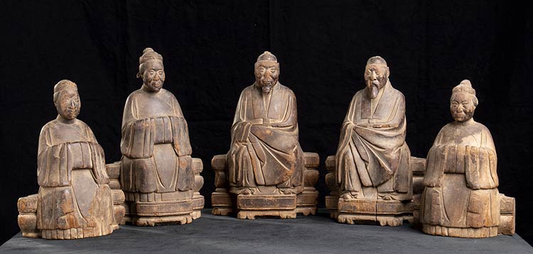 A GROUP OF FIVE WOOD SCULPTURES OF ... 