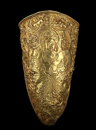 A GOLD HORN-SHAPED CONTAINER WITH ... 