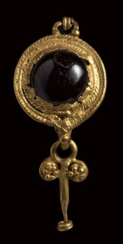 A roman gold and garnet earring ... 