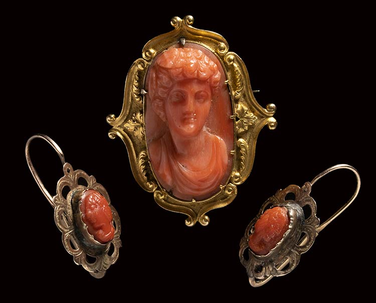 A Victorian red coral cameo set in ... 
