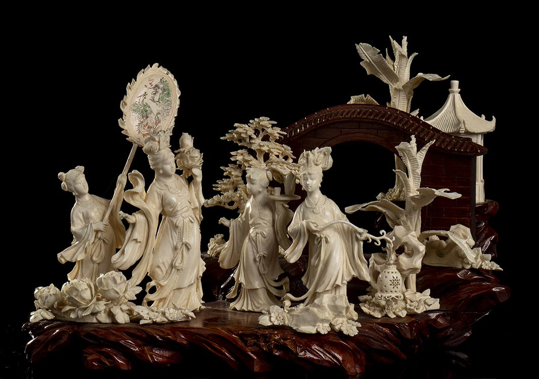AN IVORY AND WOOD GROUP WITH ... 