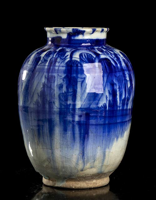 A PAINTED AND GLAZED CERAMIC VASE ... 