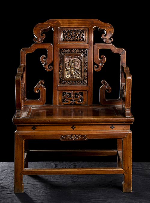 A SMALL CARVED WOOD ARMCHAIR ... 