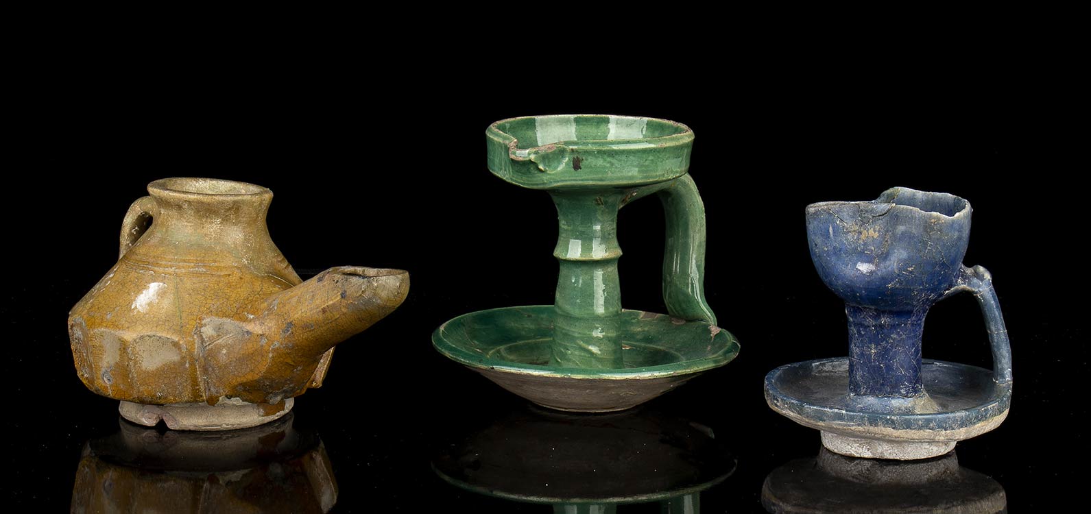 THREE GLAZED CERAMIC OIL LAMPS  ... 