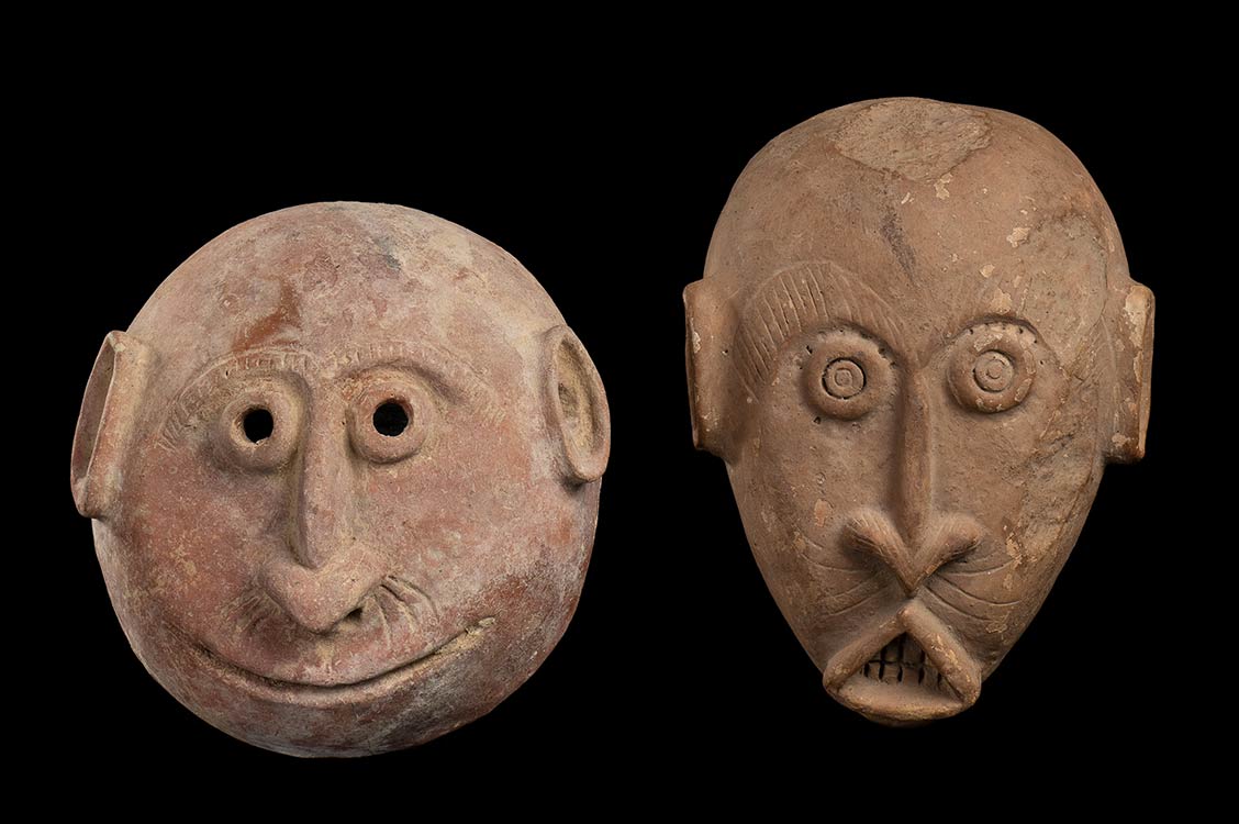 TWO POTTERY MASKS Africa21 x 19 cm ... 