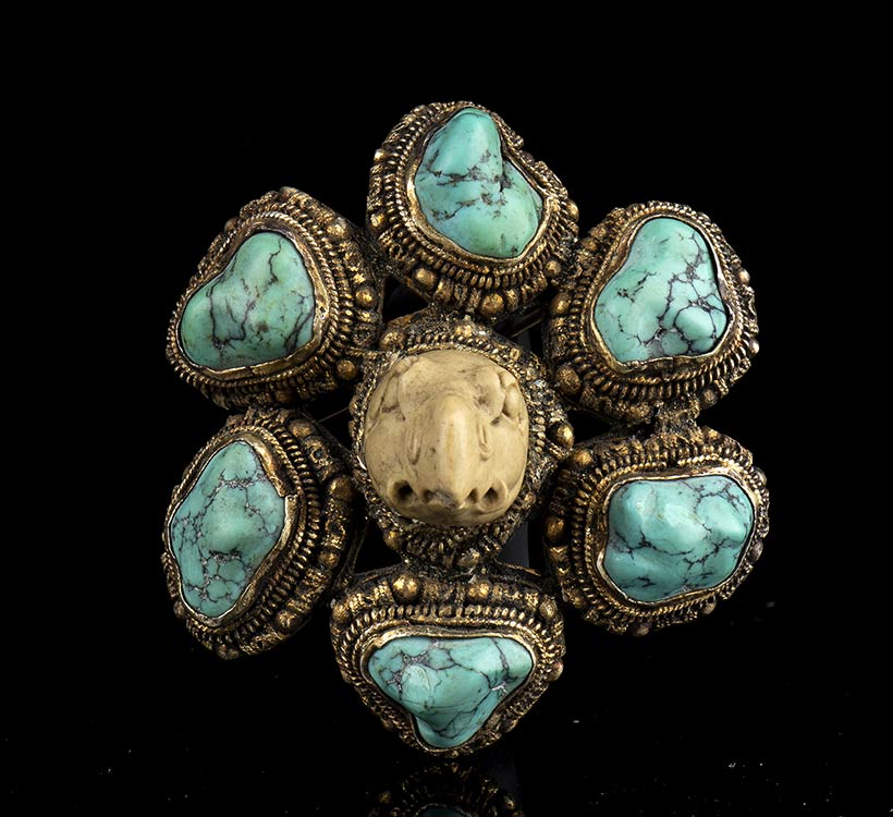 A STONE AND TURQUOISE INLAID METAL ... 