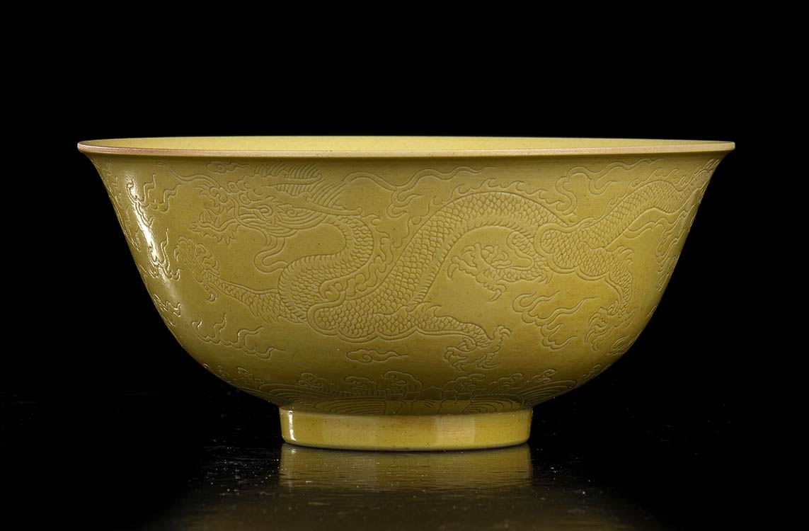 A YELLOW GLAZED AND INCISED ... 