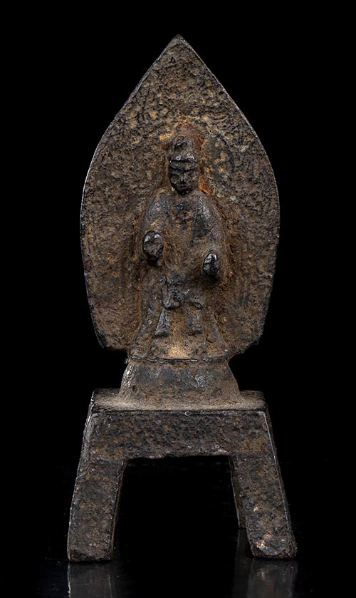 A SMALL BRONZE STELE WITH A ... 