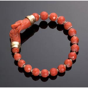 A red coral bangle bracelet with ... 