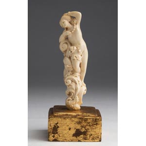 A carved ivory nude female figure ... 