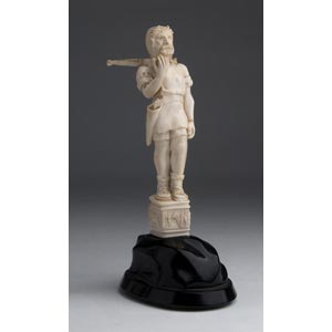 A carved ivory figure of a ... 