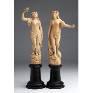 A pair of carved ivory figure of ... 