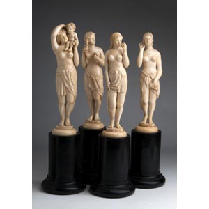 A carved ivory group of four ... 