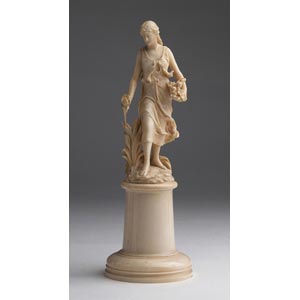 A carved ivory figure of a maiden ... 
