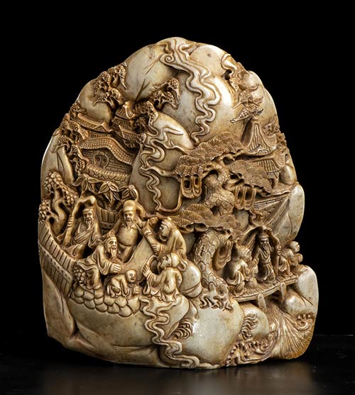 A SOAPSTONE CARVING WITH FIGURES ... 