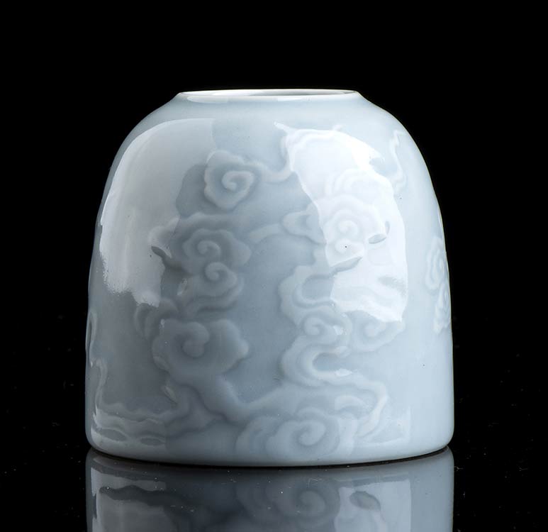 A GLAZED PORCELAIN BEEHIVE WATER ... 