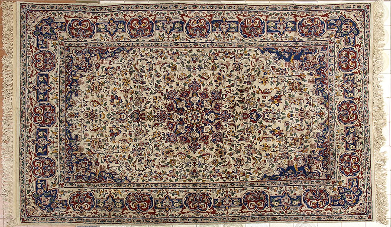 A CARPET WITH POLYCHROME FLORAL ... 